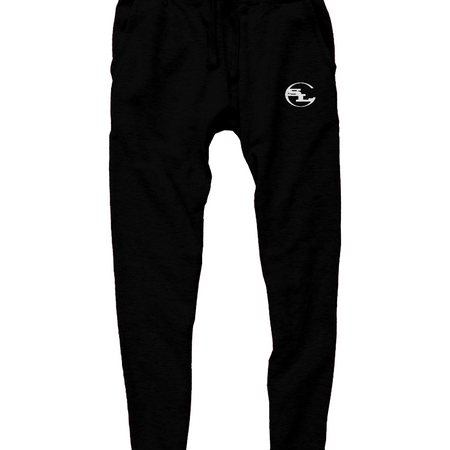 pair of black streetwear joggers by Something Light Clothing. The design features an elastic drawstring waistband and tapered legs with ribbed ankle cuffs. A white circular "SLC" monogram logo is prominently printed on the upper left thigh.