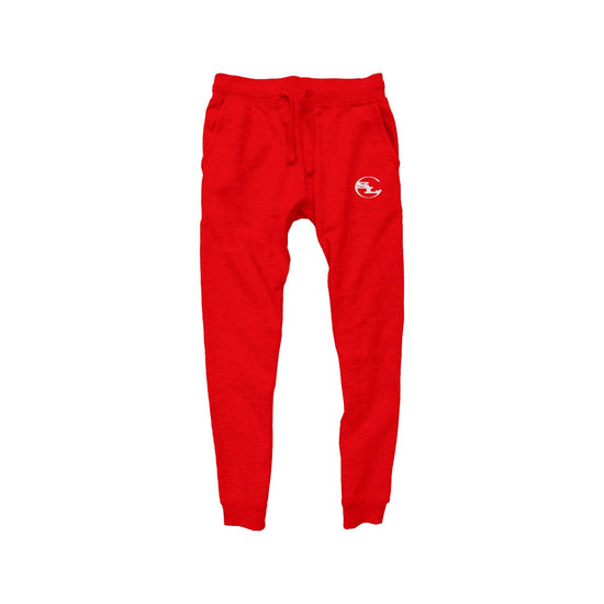 A pair of vibrant red joggers by Something Light Clothing. The pants feature a drawstring waistband and ribbed ankle cuffs. A white circular "SLC" monogram logo is printed on the upper left thigh.