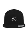 A black flat-brim snapback hat by Something Light Clothing. The front features a centered, white embroidered circular "SLC" monogram logo. An authentic "The Authentic Yupoong Snapback" silver sticker is visible on the top of the brim.