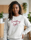 Light gray SLC™ Premium Ladies Sweatshirt by Something Light Clothing, showing a comfortable fit and soft fabric on a model.