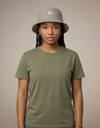 Nylon bucket hat from Something Light Clothing featuring a wide brim and casual style, suitable for sun protection and outdoor wear.