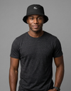 Nylon bucket hat from Something Light Clothing featuring a casual, wide-brim design in a neutral color.