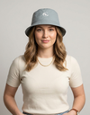 Nylon bucket hat from Something Light Clothing featuring a wide brim and casual style, ideal for sun protection and outdoor wear.