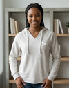 Gray SLC™ Hooded Sweatshirt from Something Light Clothing, featuring a relaxed fit and adjustable hood, displayed on a hanger.